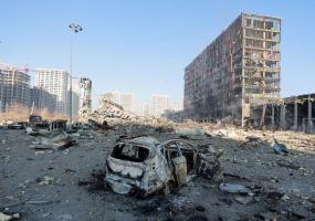 A view shows a destroyed car at the site of a shelling of a shopping center in the Podilskyi district of Kyiv, as Russia's invasion of Ukraine continues, in Kyiv, Ukraine March 21, 2022. REUTERS/Serhii Nuzhnenko