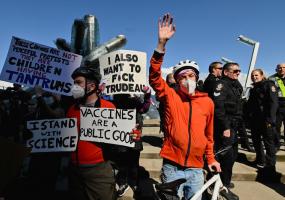 Counter-protesters disrupt a rally held by opponents of the coronavirus disease (COVID-19) vaccine and mask mandates, in downtown Vancouver, British Columbia, Canada March 19, 2022. REUTERS/Jennifer Gauthier